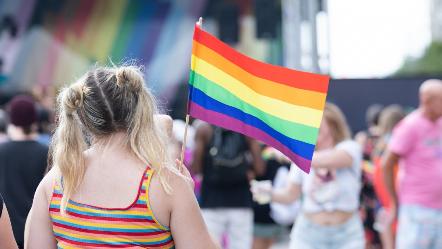 An Outfest attendee waves a rainbow flag on June 4, 2022. Outfest featured performances, food and vendors in honor of Pride month.&nbsp;