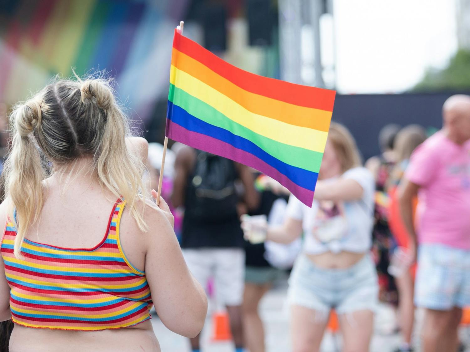 An Outfest attendee waves a rainbow flag on June 4, 2022. Outfest featured performances, food and vendors in honor of Pride month.&nbsp;