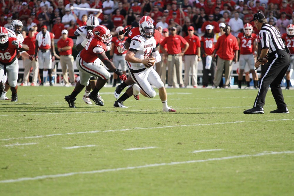 	Connor Shaw looks to avoid the sack against the Bulldogs pass rush which affected him most of the game.