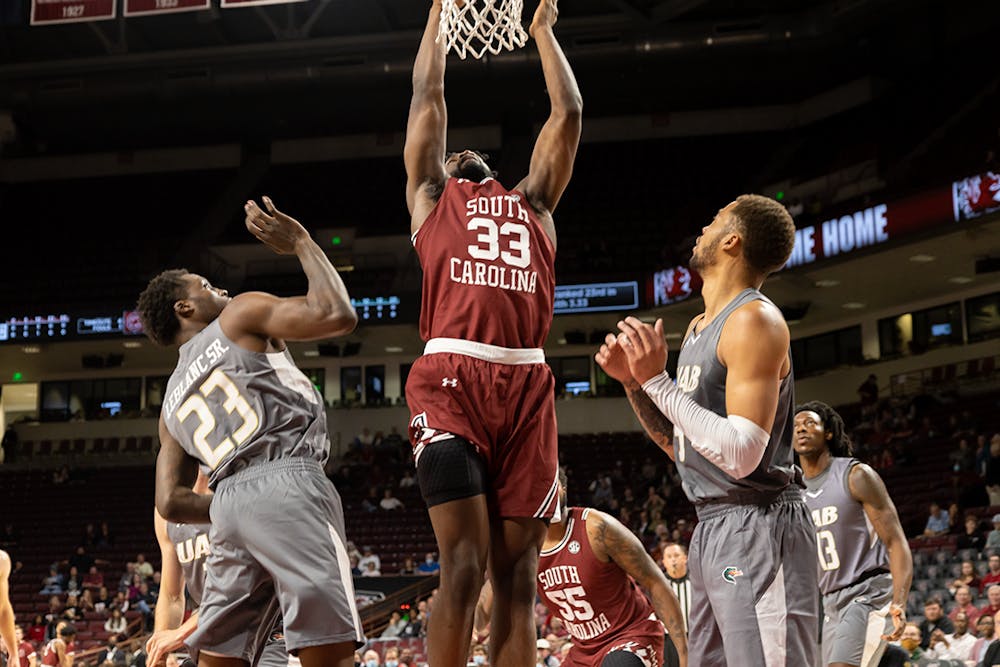 <p>Sophomore forward Josh Gray goes up to dunk the ball, scoring points for the Gamecocks. During this game against UAB on Nov. 18, 2021, the Gamecocks won by a score of 66-63.</p>
