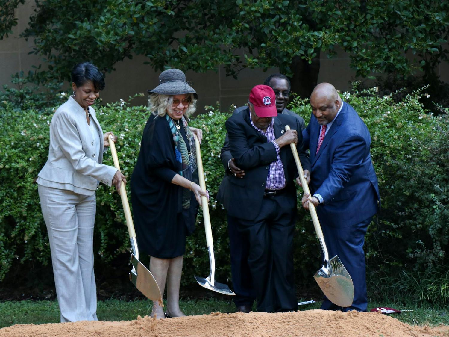 Cindy Baumgardner, the second cousin of Robert G. Anderson (left), Henrie Monteith Treadwell (center left), James L. Solomon Jr. (center right) and his son, Carl Solomon (right), turn dirt where the statue memorializing USC's desegregation will stand on Sept. 11, 2023. Anderson, Treadwell and Solomon Jr. registered for classes exactly 60 years ago today, marking the beginning of desegregation at the University of South Carolina.