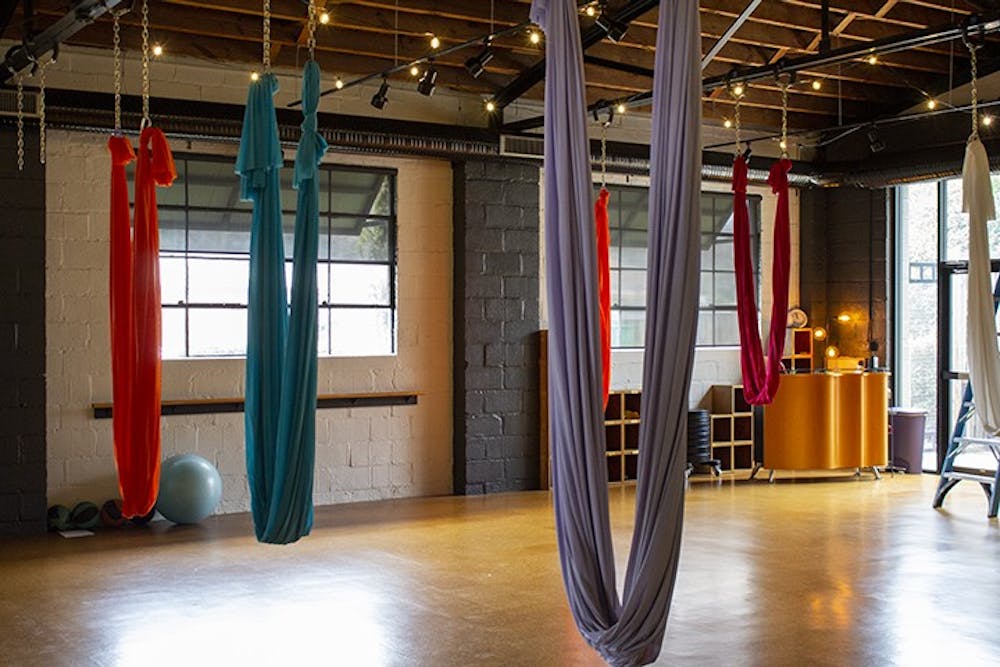 <p>Fit Columbia, located at 2121 College St., is known for its aerial yoga, with colorful silks hanging from the ceiling that help customers soar into the air effortlessly.</p>