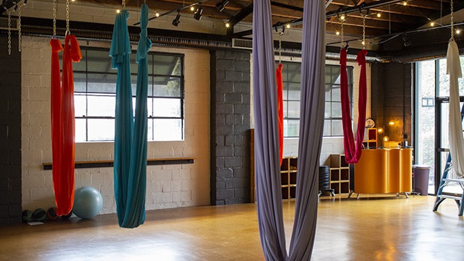 Fit Columbia, located at 2121 College St., is known for its aerial yoga, with colorful silks hanging from the ceiling that help customers soar into the air effortlessly.