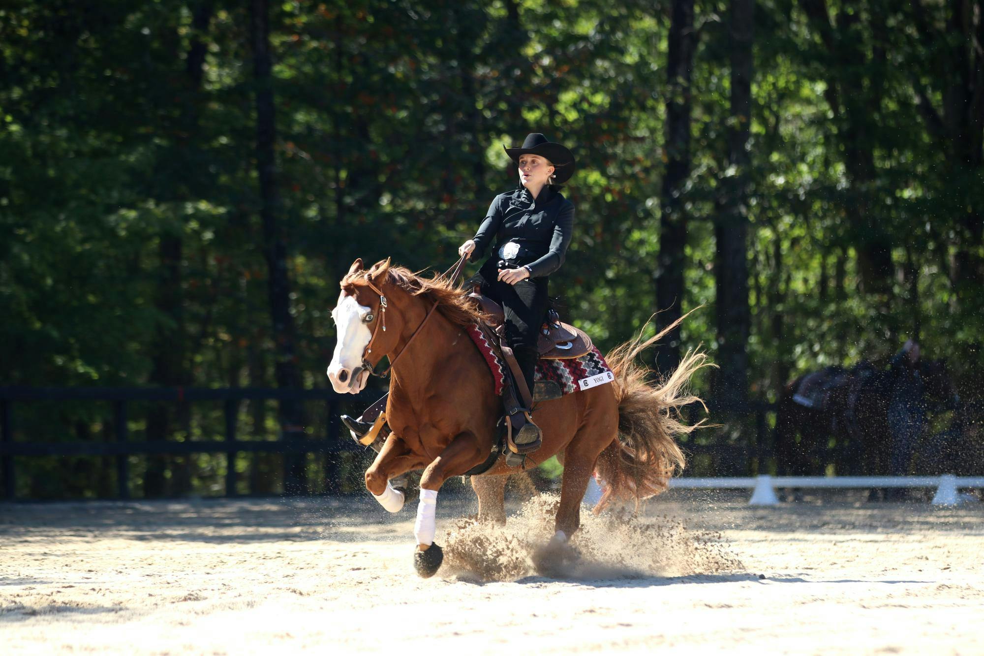 Reining graduate student Haley Turner rides Yogi in the second half of the reining division against Texas A&amp;M at One Wood Farm on Oct. 17, 2025. Turner ended up doing a re-ride on a different horse after some technical complications with Yogi's performance.