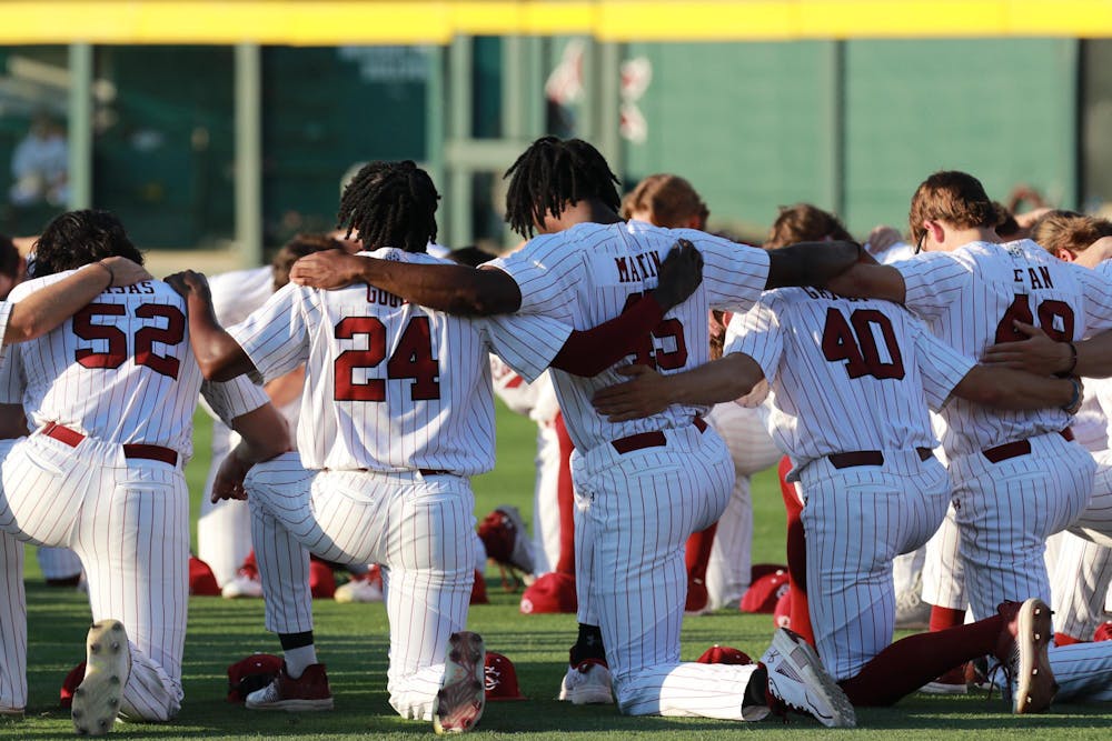 <p>The Gamecocks kneel in a circle and pray as part of their pre-game ritual on April 19, 2024. The No. 20 South Carolina Gamecocks were defeated by the No. 2 Arkansas Razorbacks 2-1 in the first game of the weekend series.</p>