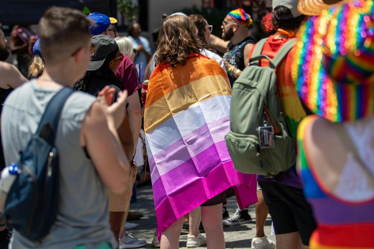 A supporter with a pride flag wrapped around their body during the drag competition at Outfest on June 1, 2024. Outfest, run by South Carolina Pride since 1989, features LGBTQIA+ events like the Famously Hot SC Pride Festival, Get Lit Nighttime Parade &amp; Concert and more.