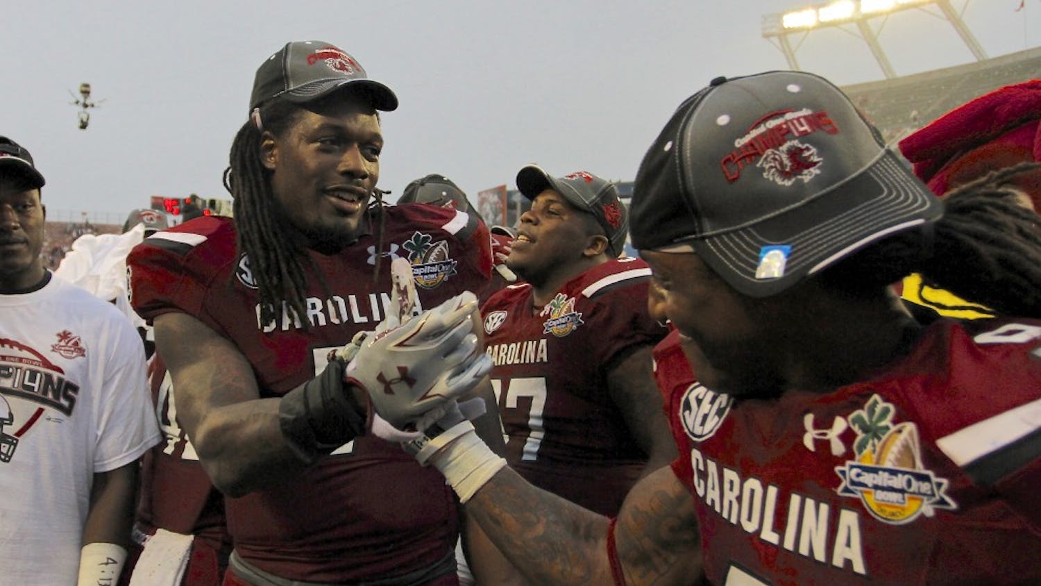 	Junior defensive end Jadeveon Clowney celebrates his last win at South Carolina with teammate Sharrod Golightly at the Capital One Bowl on Jan. 1.