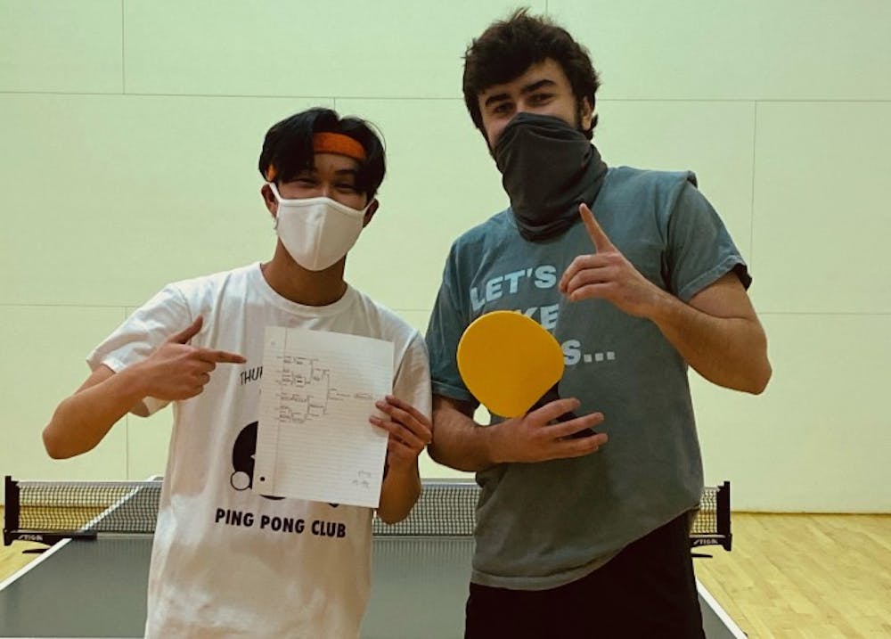 <p>Andrew Nguyen (left) and Jack Brantley (right) pose after a club table tennis tournament. The club has about 40 members who practice every Monday.</p>