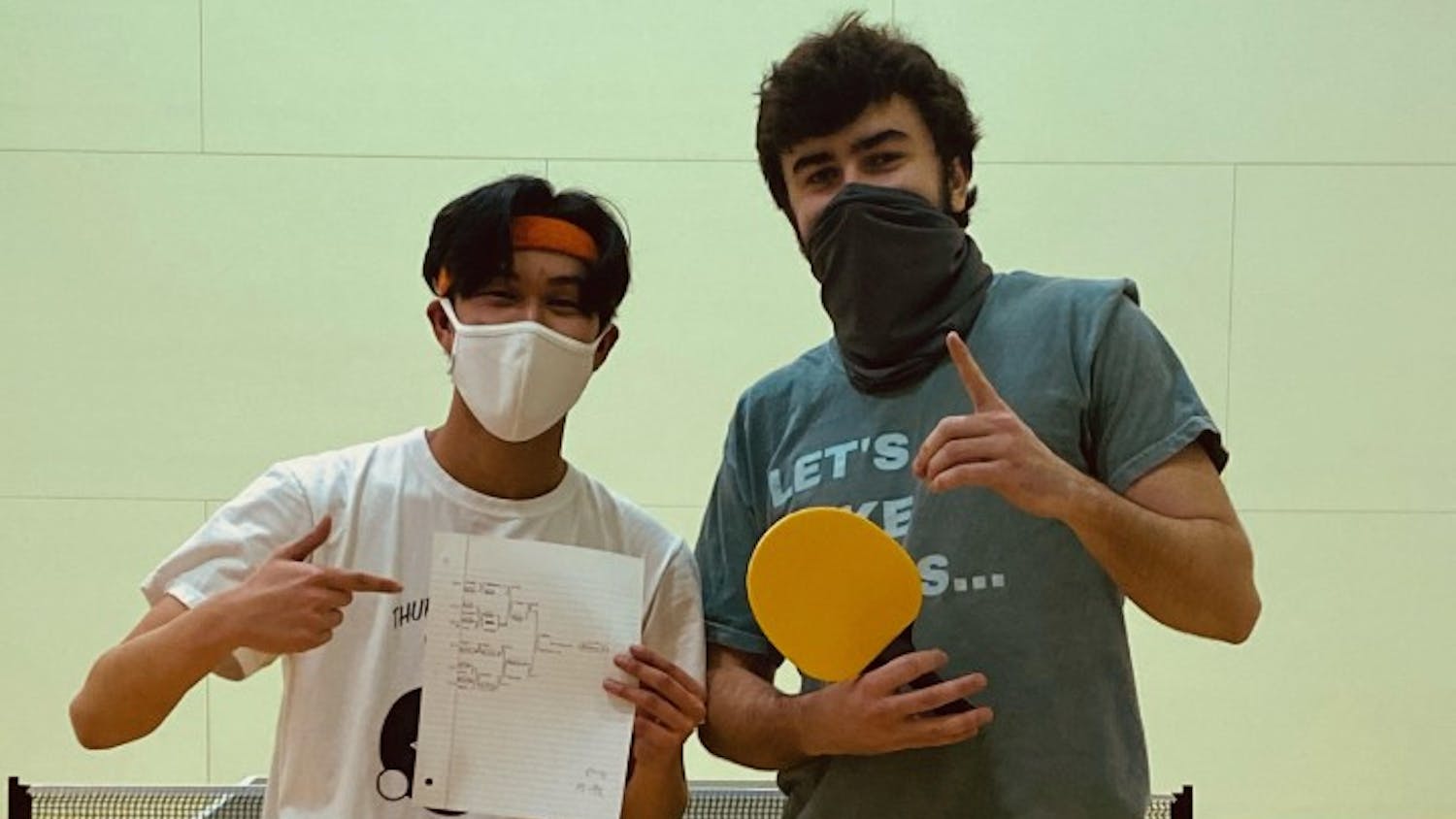 Andrew Nguyen (left) and Jack Brantley (right) pose after a club table tennis tournament. The club has about 40 members who practice every Monday.
