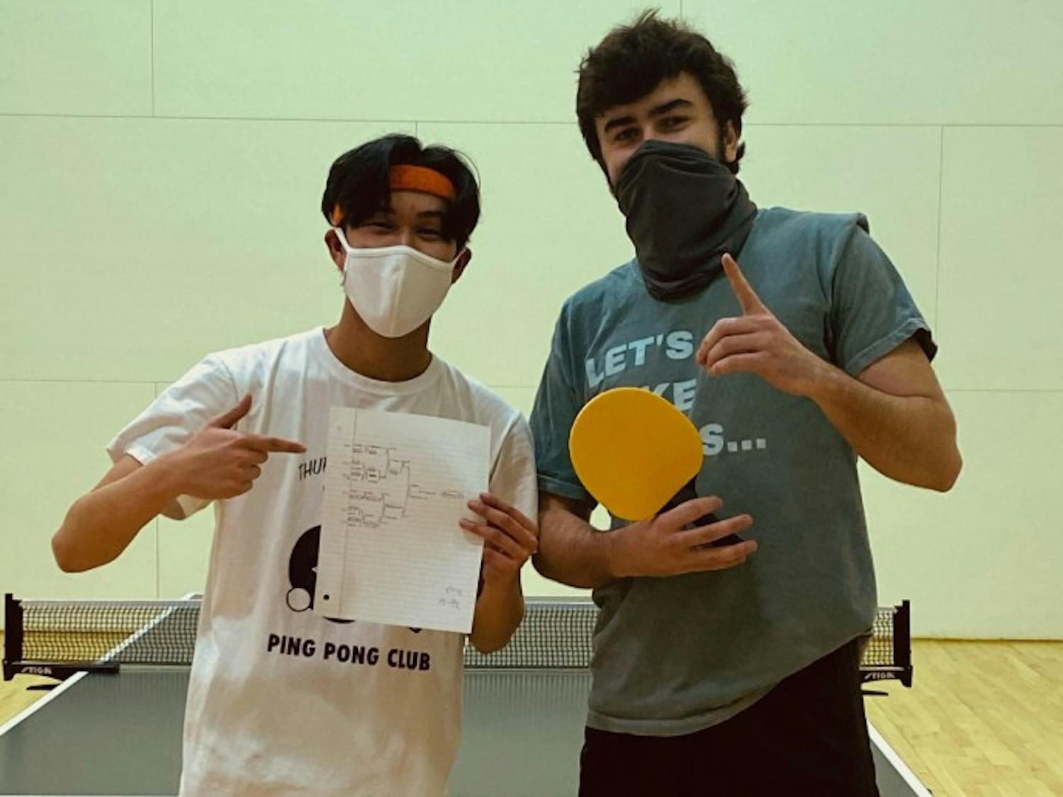 Andrew Nguyen (left) and Jack Brantley (right) pose after a club table tennis tournament. The club has about 40 members who practice every Monday.