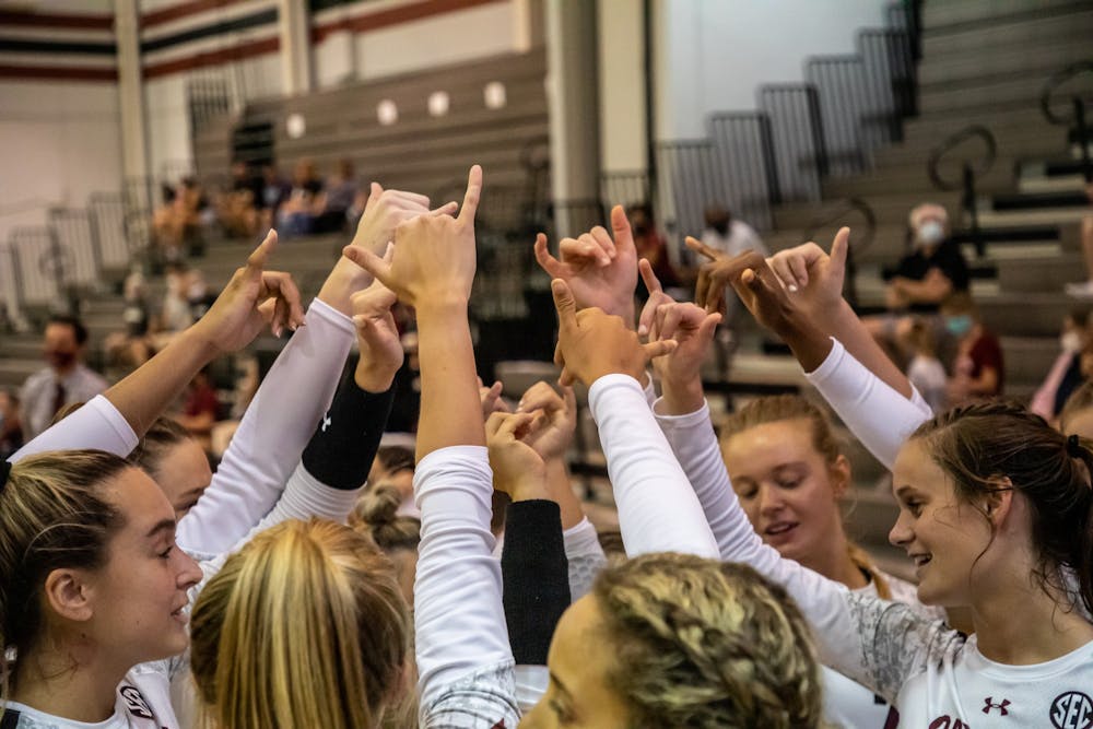 FILE— The volleyball team huddles together following their match against UCF on Sept. 3, 2021. South Carolina defeated UCF 3-1