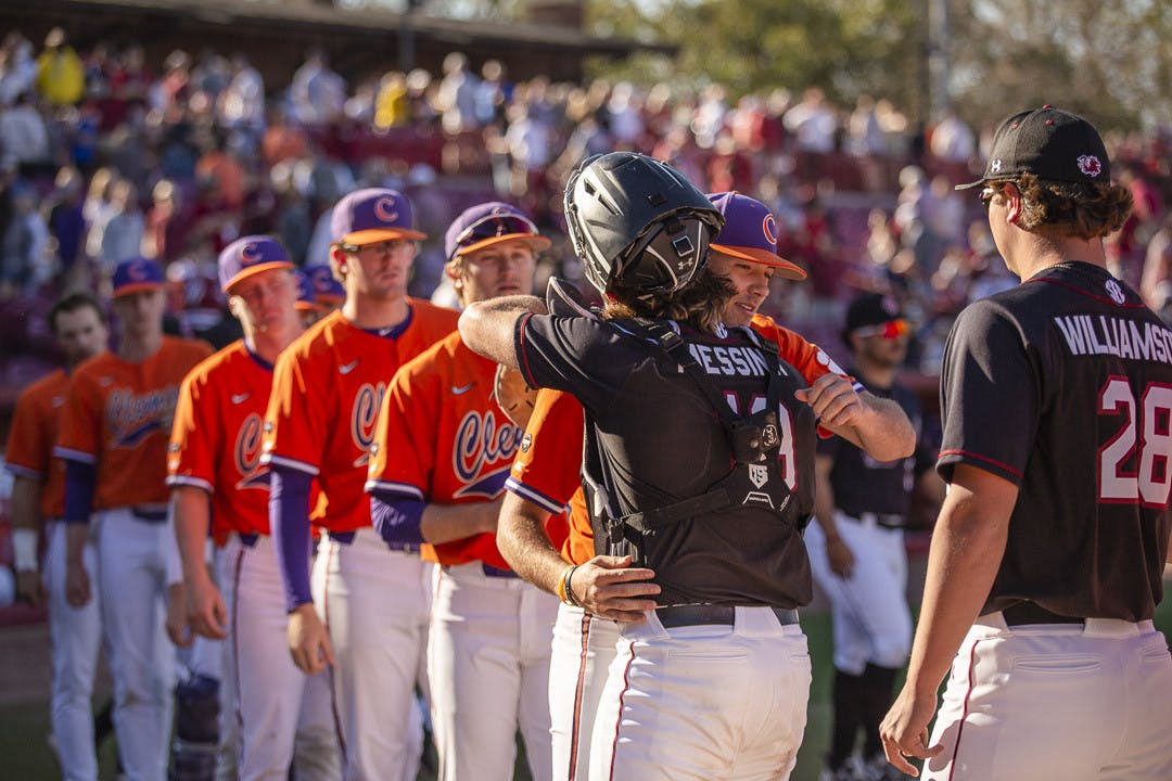 Sophomore catcher Cole Messina hugs one of Clemson's players after the final game of the series between South Carolina and Clemson on March 5, 2023, at Founders Park. The Gamecocks beat the Tigers 7-1, winning 2-1 in the series.&nbsp;
