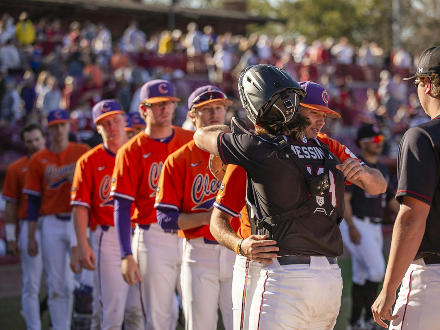 Sophomore catcher Cole Messina hugs one of Clemson's players after the final game of the series between South Carolina and Clemson on March 5, 2023, at Founders Park. The Gamecocks beat the Tigers 7-1, winning 2-1 in the series.&nbsp;