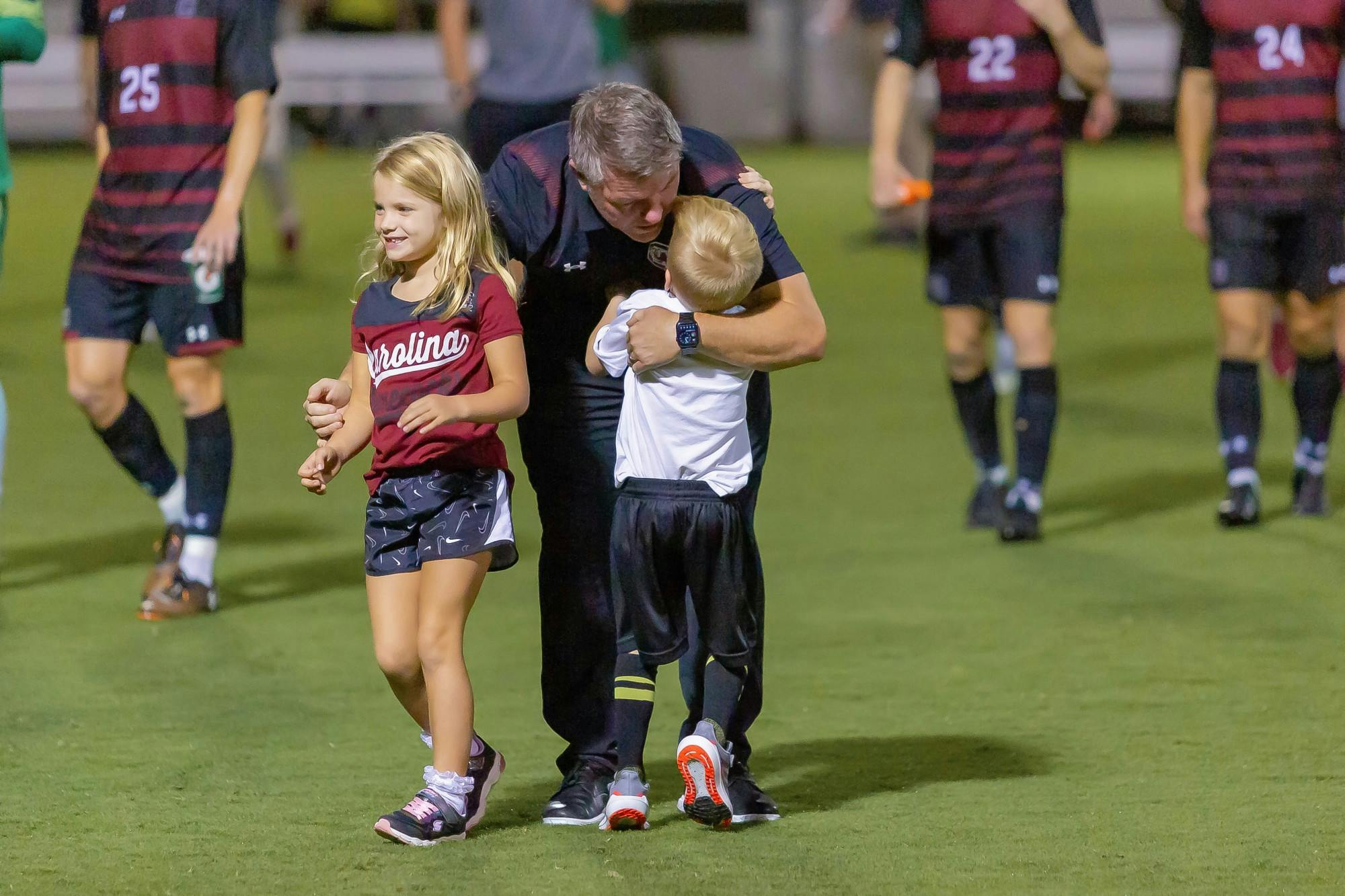 FILE—South Carolina men's soccer head coach Tony Annan meets his children on the field following a victory over Gardner-Webb on Sept. 28, 2021 in Columbia, SC. Annan was named the Gamecocks’ head men’s soccer coach on April 22, 2021.