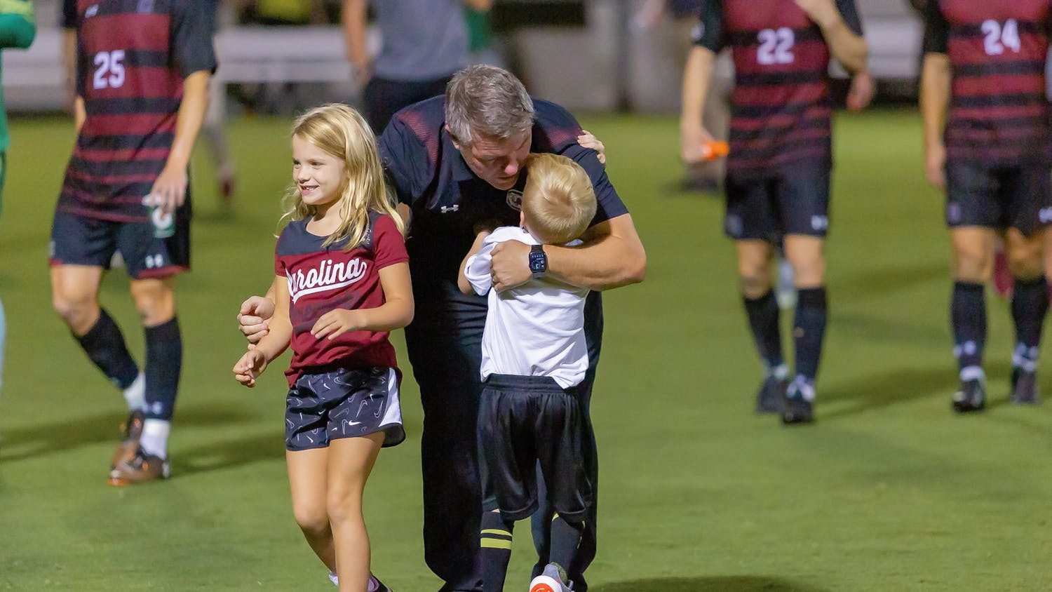 FILE—South Carolina men's soccer head coach Tony Annan meets his children on the field following a victory over Gardner-Webb on Sept. 28, 2021 in Columbia, SC. Annan was named the Gamecocks’ head men’s soccer coach on April 22, 2021.