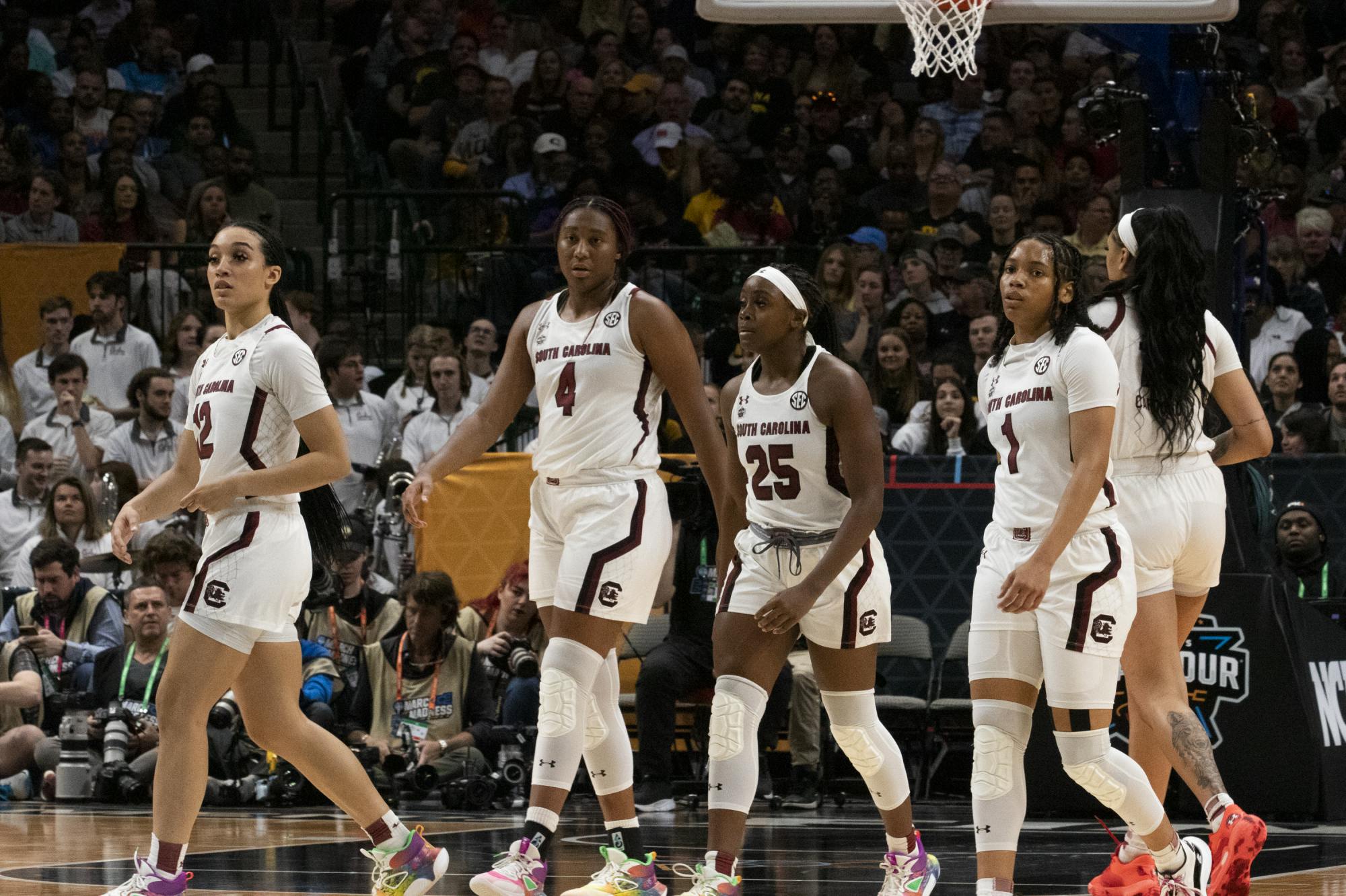 Boston, Beal, redshirt freshman guard Raven Johnson, junior center Kamilla Cardoso and Cooke reset after a timeout at the Final Four match against the University of Iowa on March 31, 2023. The Hawkeyes led 22-13 by the end of the first quarter.