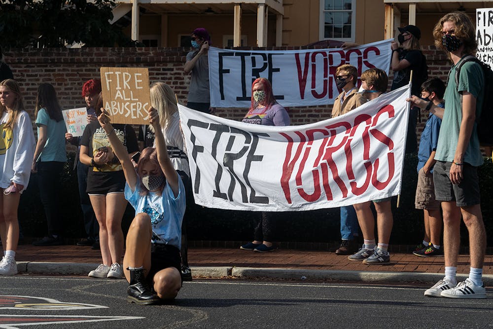 <p>Supporters of the Coalition to Fire David Voros made signs to protest the employment of David Voros, Micheal Dollar and Robert Richmond.</p>