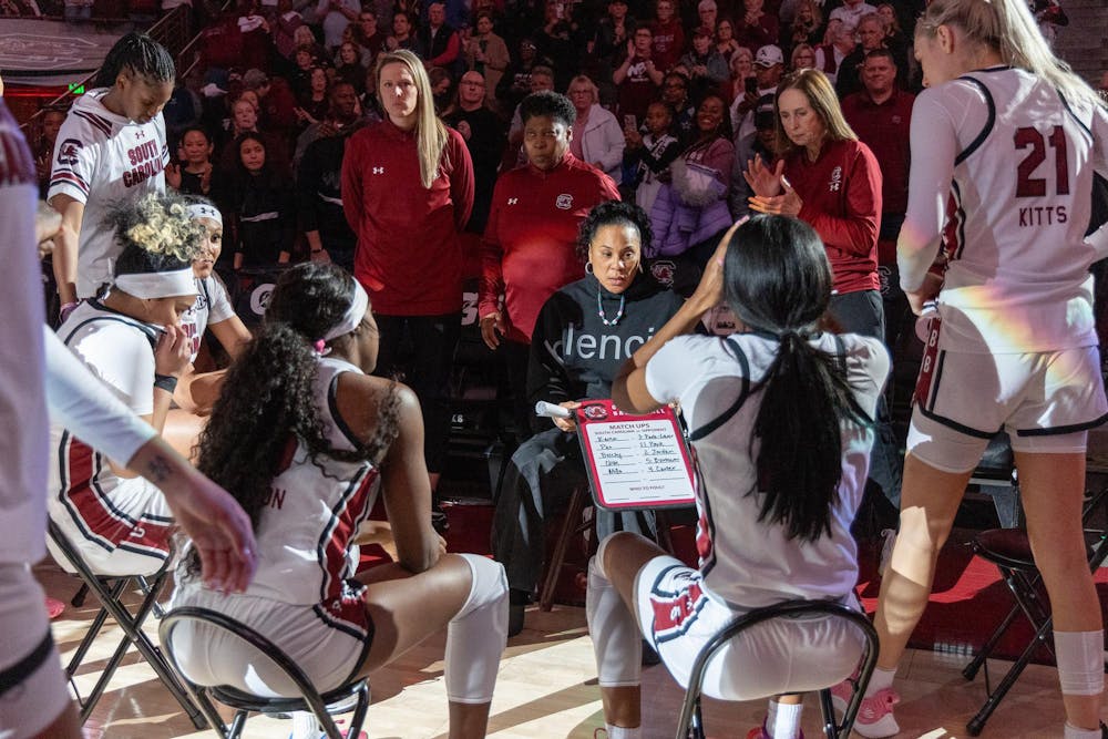 <p>FILE — The Gamecock women's basketball team huddles around head coach Dawn Staley during a timeout on Jan. 7, 2024. The team secured on Sunday afternoon its eighth tournament championship in the past decade.</p>