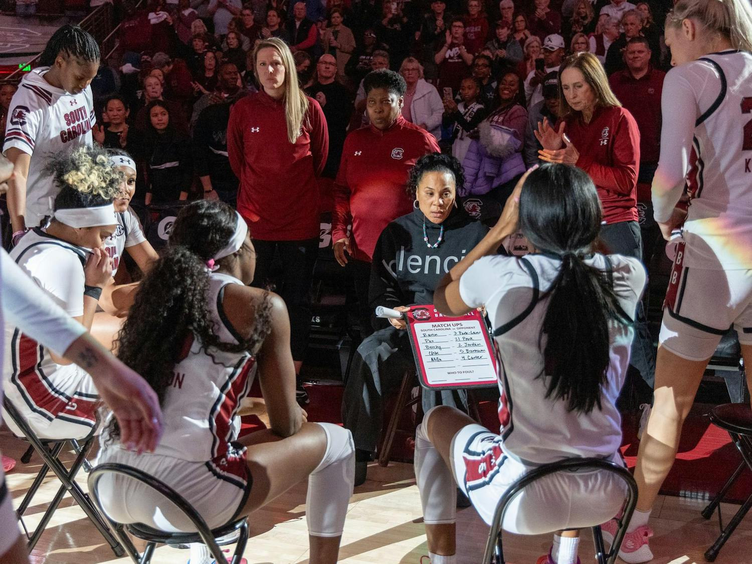 FILE — The Gamecock women's basketball team huddles around head coach Dawn Staley during a timeout on Jan. 7, 2024. The team secured on Sunday afternoon its eighth tournament championship in the past decade.