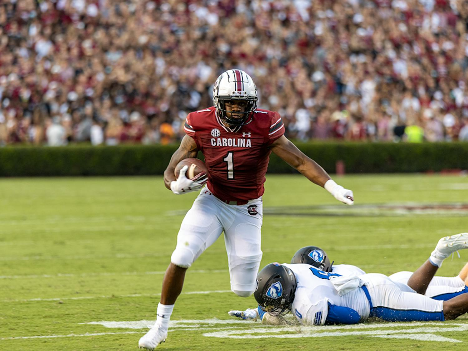 FILE— Then redshirt freshman running back Marshawn Lloyd evades a tackle attempt made by an Eastern Illinois player during the 2021 season opener. Lloyd made the first down for the Gamecocks.