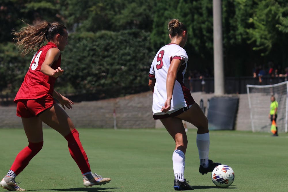 <p>FILE — Junior forward Reagan Schubach dribbles the ball next to a Miami University forward during a match on Aug. 24, 2025, at Stone Stadium. The Gamecocks traveled to Clemson to take on the Tigers on Aug. 28, 2025, ending in a score of 0-0.</p>