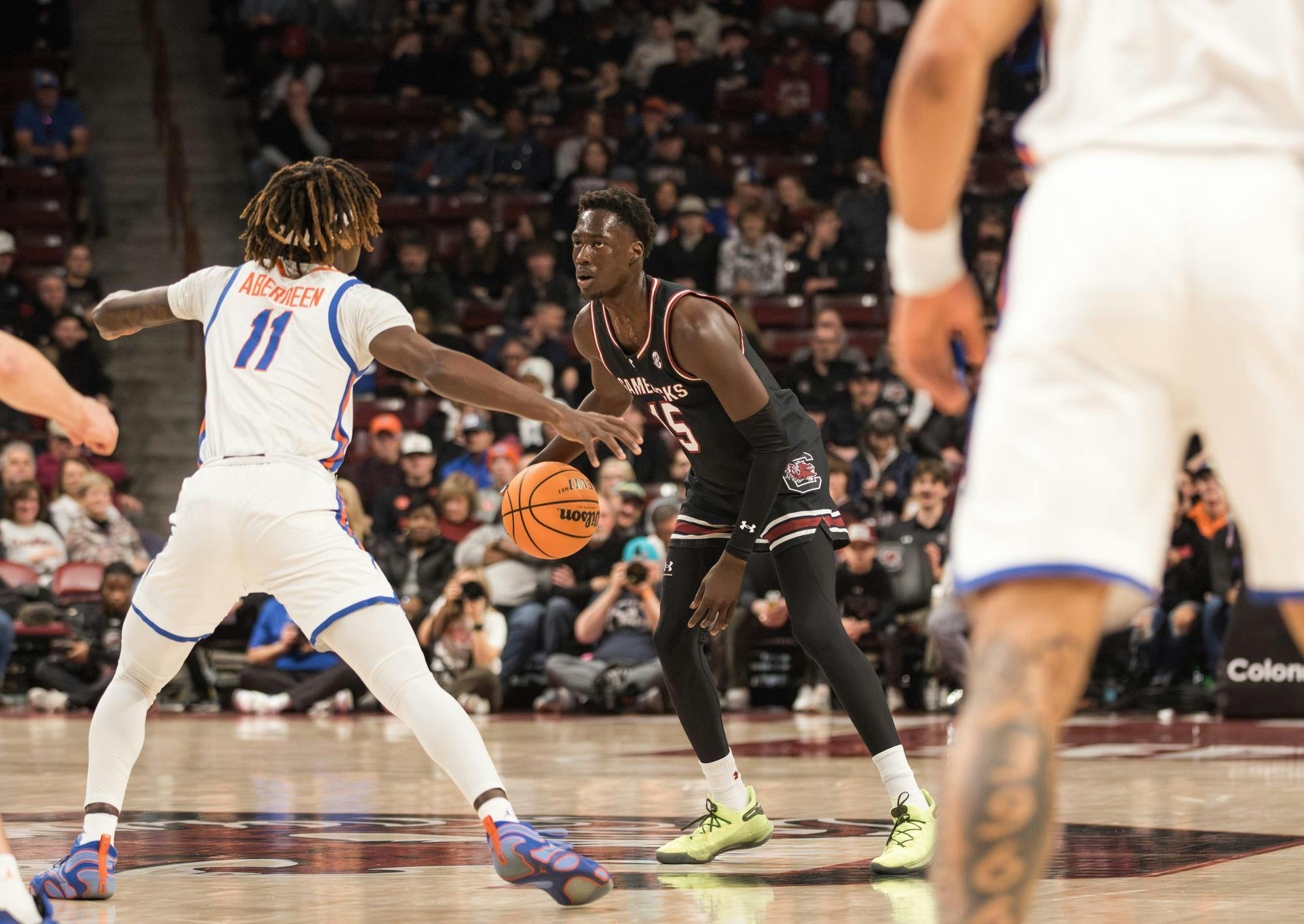 Then-sophomore guard Morris Ugusuk looks for an option around the Gator players on Jan. 22, 2025, in Colonial Life Arena. Ugusuk played for 31 minutes and scored 9 points for the Gamecocks.