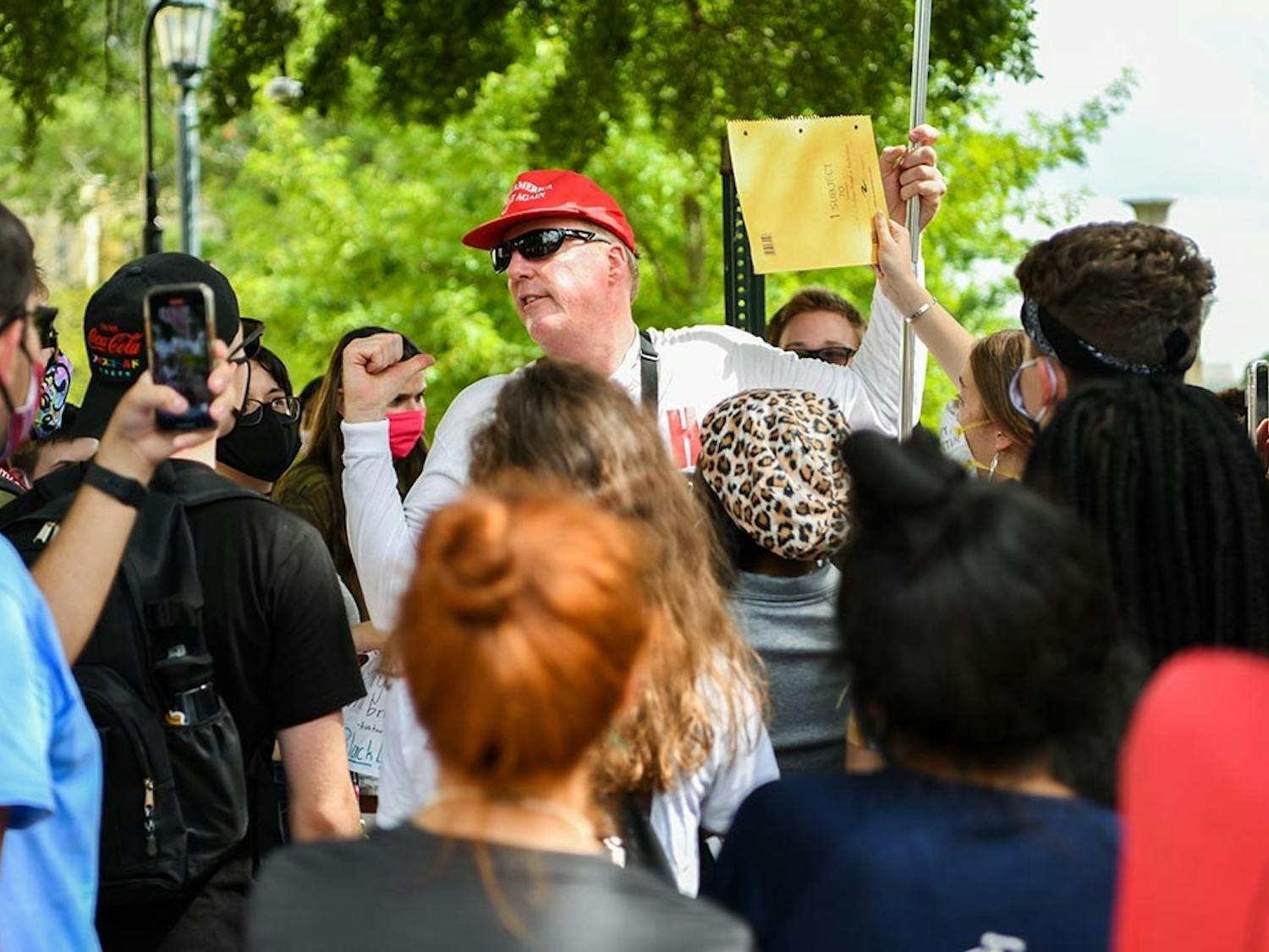 Jim Gilles preaches to students protesting his presence on Greene Street Friday, Aug. 21. Pictured is him saying, “I see the intelligence level getting lower and lower,” after a student tried to reason with him.