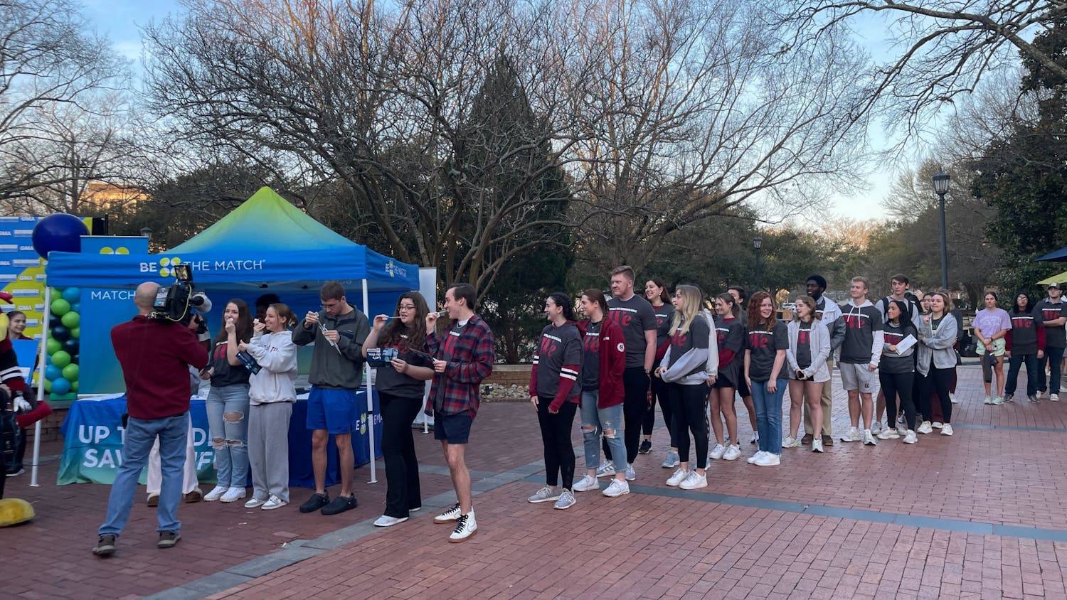 A line of students grows outside of the Russell House patio for the “Be the Match” event on Feb. 21, 2023. Students were given cotton swabs by the National Marrow Donor Program to extract their DNA, hoping to learn that they could be a matching blood type for someone in need.