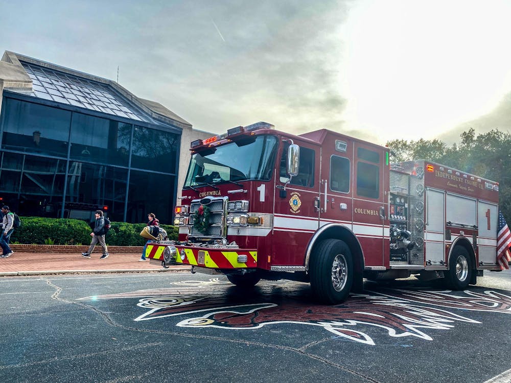 <p>A Columbia Fire Department engine sits on Greene Street in front of Russell House on the University of South Carolina campus on Nov. 30, 2023. The department responded to a fire alarm in the building just before 3 p.m.</p>