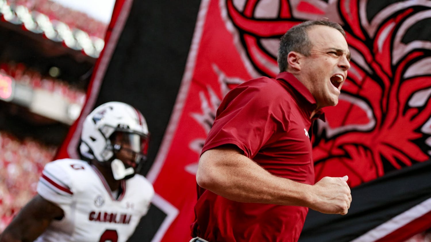 FILE—Head coach Shane Beamer runs out on the field before warm-ups during South Carolina’s game against Georgia on Sept. 18, 2021. The Gamecocks lost 40-13. 