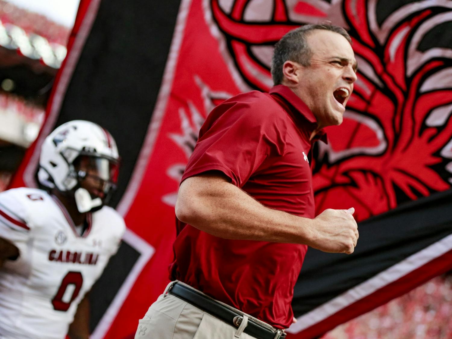 FILE—Head coach Shane Beamer runs out on the field before warm-ups during South Carolina’s game against Georgia on Sept. 18, 2021. The Gamecocks lost 40-13. 