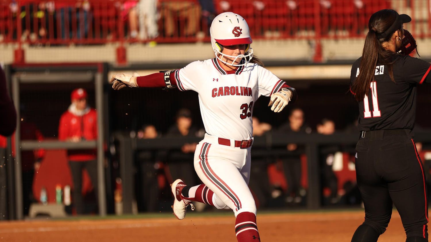 Sophomore infielder Karley Shelton hits the ball and runs to first against Texas Tech at Beckham Field. Gamecock softball won 5-2 in its first of three games against Texas Tech on March 21st.