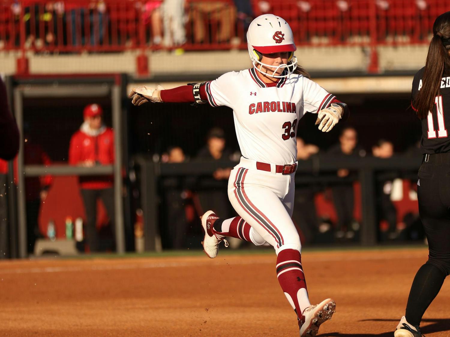 Sophomore infielder Karley Shelton hits the ball and runs to first against Texas Tech at Beckham Field. Gamecock softball won 5-2 in its first of three games against Texas Tech on March 21st.