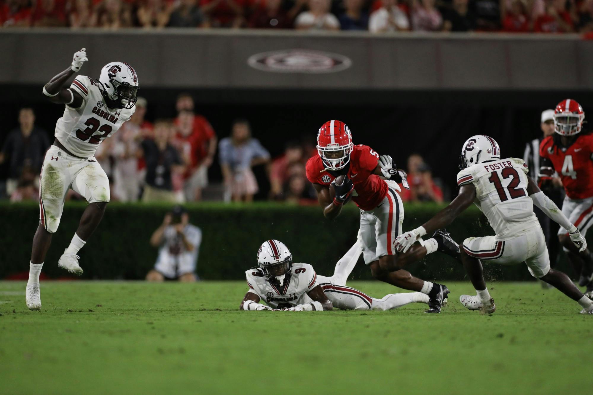 Redshirt sophomore defensive back Cam Smith attempts a tackle on a Bulldogs player. The Gamecocks received their first loss of the season in Saturday's game against UGA.