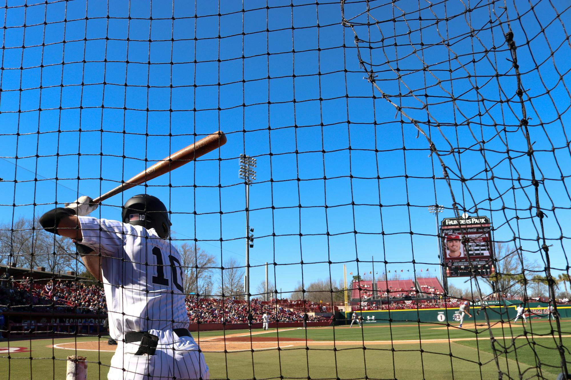 Senior outfield Dylan Brewer loosens up prior to taking bat on Feb. 18, 2023. The Gamecocks defeated UMass Lowell 17-1.  