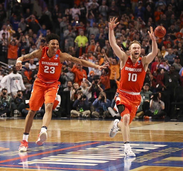 Syracuse Orange guard Malachi Richardson (23) and Syracuse Orange guard Trevor Cooney (10) celebrate at the end of their team&apos;s 68-62 win over the Virginia Cavaliers on Sunday, March 27, 2016, at the United Center in Chicago. (Nuccio DiNuzzo/Chicago Tribune/TNS)