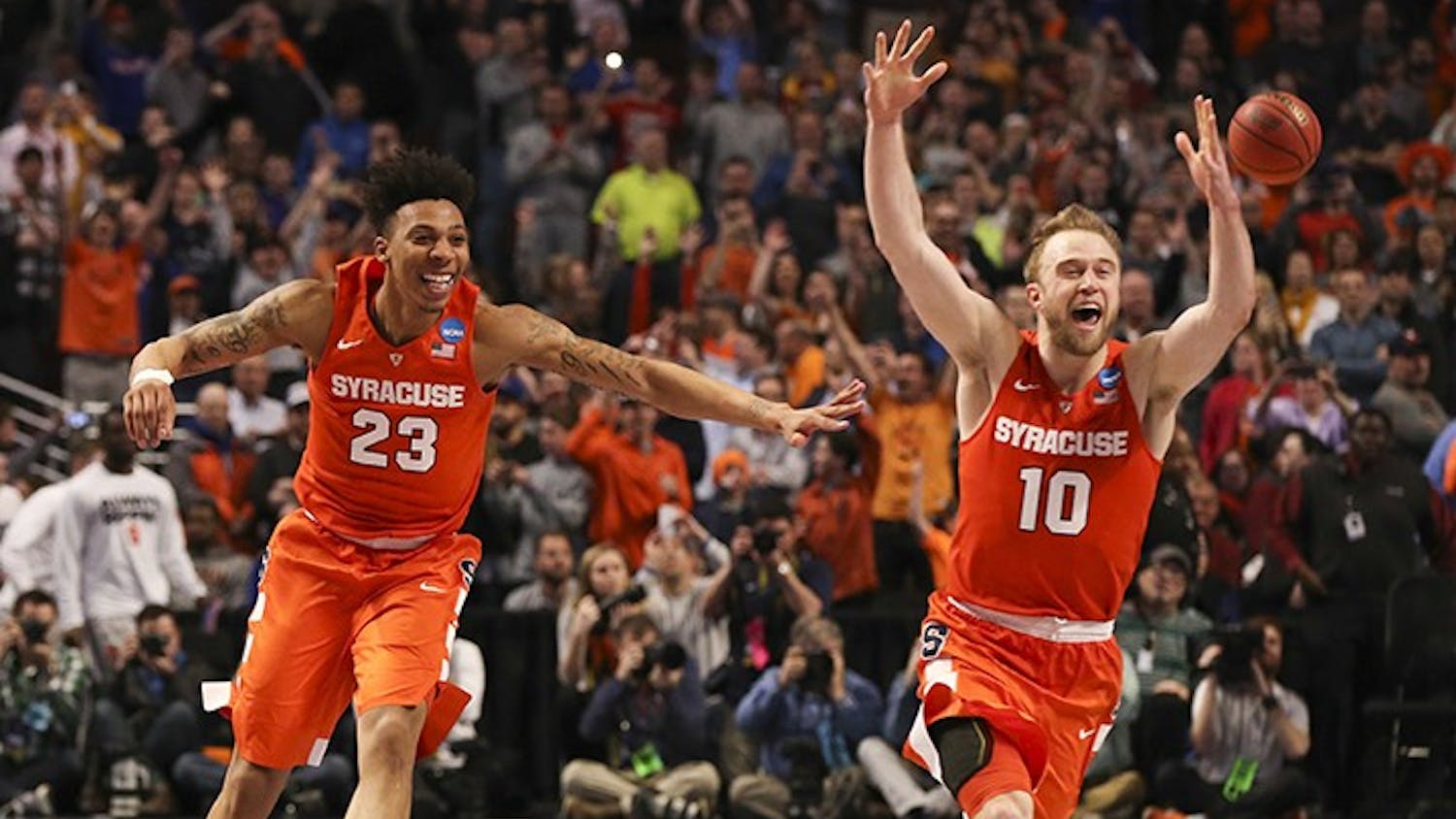 Syracuse Orange guard Malachi Richardson (23) and Syracuse Orange guard Trevor Cooney (10) celebrate at the end of their team's 68-62 win over the Virginia Cavaliers on Sunday, March 27, 2016, at the United Center in Chicago. (Nuccio DiNuzzo/Chicago Tribune/TNS)