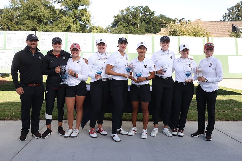 <p>FILE — South Carolina 2021 women's golf team with trophies after the Landfall Tradition Tournament. The team finished its season with two wins, as the No. 3 team in the country and is currently training for the spring season.</p>