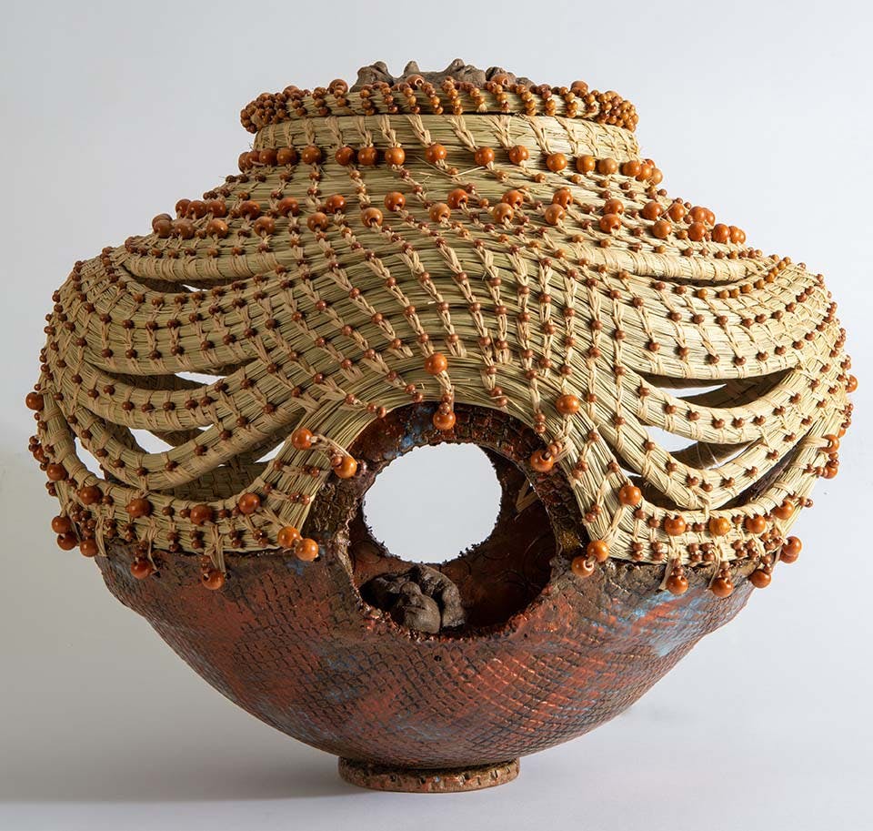 "Four Corners of Justice" created in 2015 by Georgette Sanders. Sanders used clay, sweetgrass, and wood to create this piece.