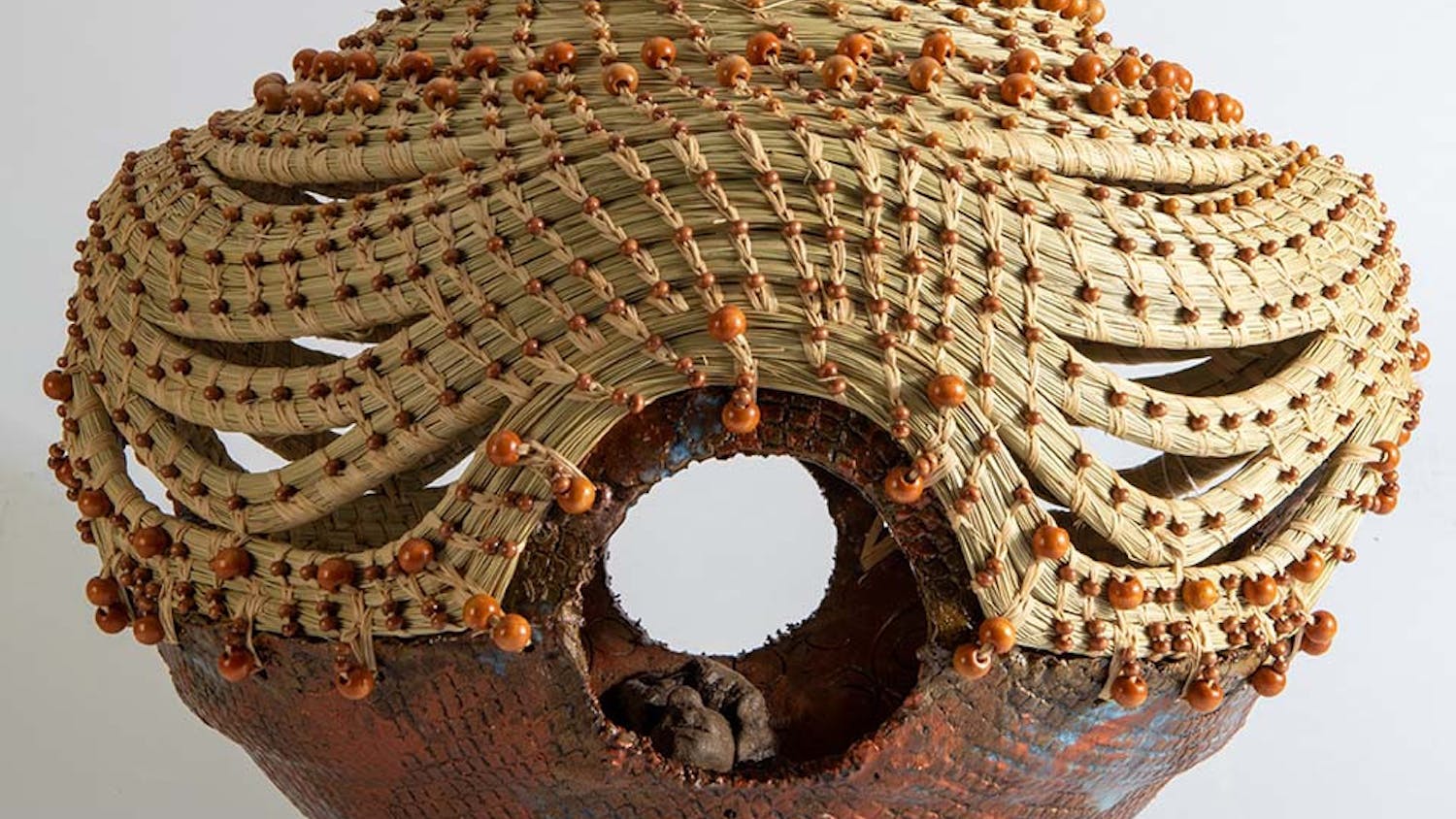 "Four Corners of Justice" created in 2015 by Georgette Sanders. Sanders used clay, sweetgrass, and wood to create this piece.