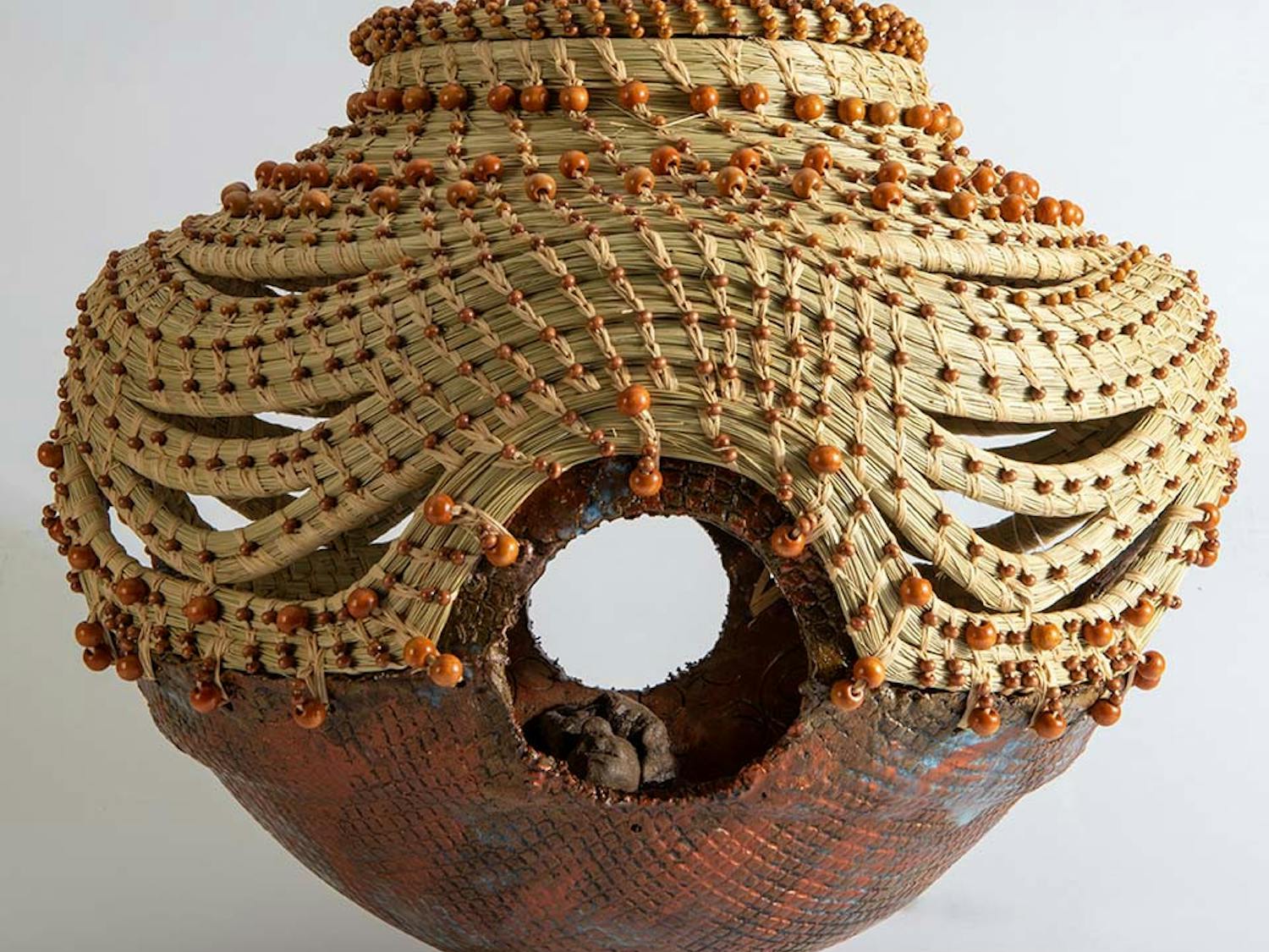 "Four Corners of Justice" created in 2015 by Georgette Sanders. Sanders used clay, sweetgrass, and wood to create this piece.