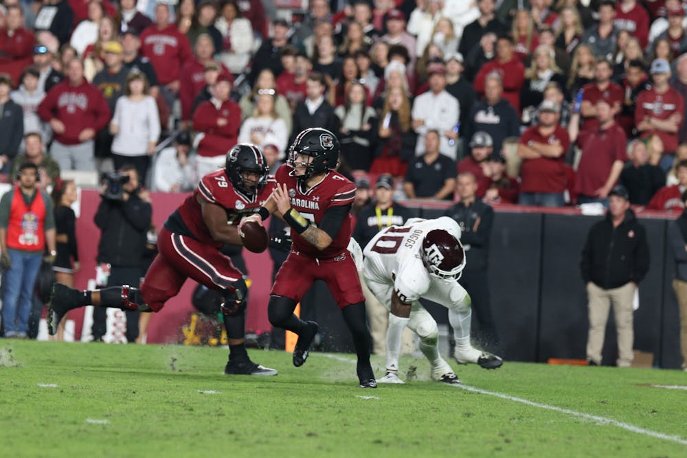 <p>FILE — Redshirt junior quarterback Spencer Rattler scrambles out of the pocket while looking downfield for open receivers in the fourth quarter against the Texas A&amp;M Aggies at Williams-Brice Stadium on Oct. 22, 2022. The Gamecocks defeated the Aggies 30-24.&nbsp;</p>