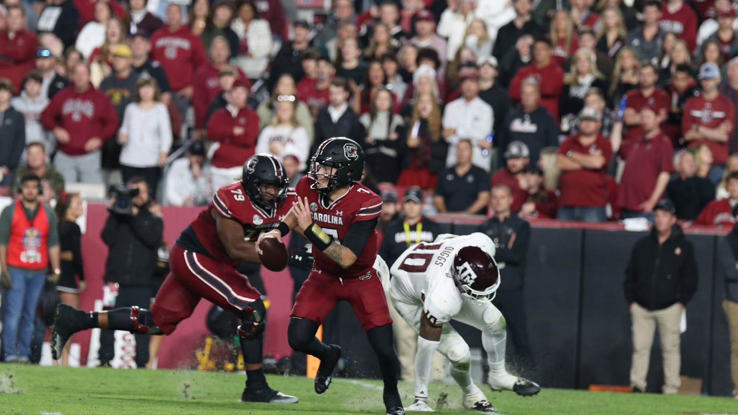 FILE — Redshirt junior quarterback Spencer Rattler scrambles out of the pocket while looking downfield for open receivers in the fourth quarter against the Texas A&M Aggies at Williams-Brice Stadium on Oct. 22, 2022. The Gamecocks defeated the Aggies 30-24. 