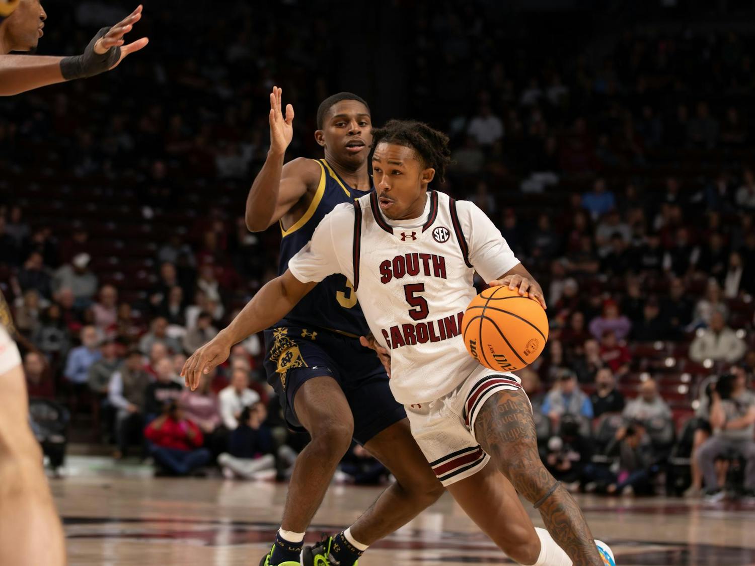Junior guard Meechie Johnson drives to the basket during his career-best scoring game against Notre Dame on Nov. 28, 2023. Johnson ended the game with a total of 29 points, fueling the Gamecocks' 65-53 win.