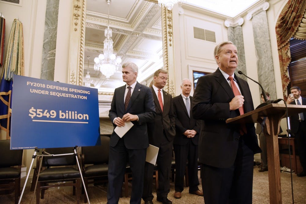 U.S. Sen. Lindsey Graham (R-S.C.) speaks as Sen. Bill Cassidy (R-La.), Sen. Dean Heller (R-Nev.), Sen. Ron Johnson (R-Wis.) listen during a news conference on health care on Wednesday, Sept. 13, 2017 on Capitol Hill in Washington, D.C. (Olivier Douliery/Abaca Press/TNS)