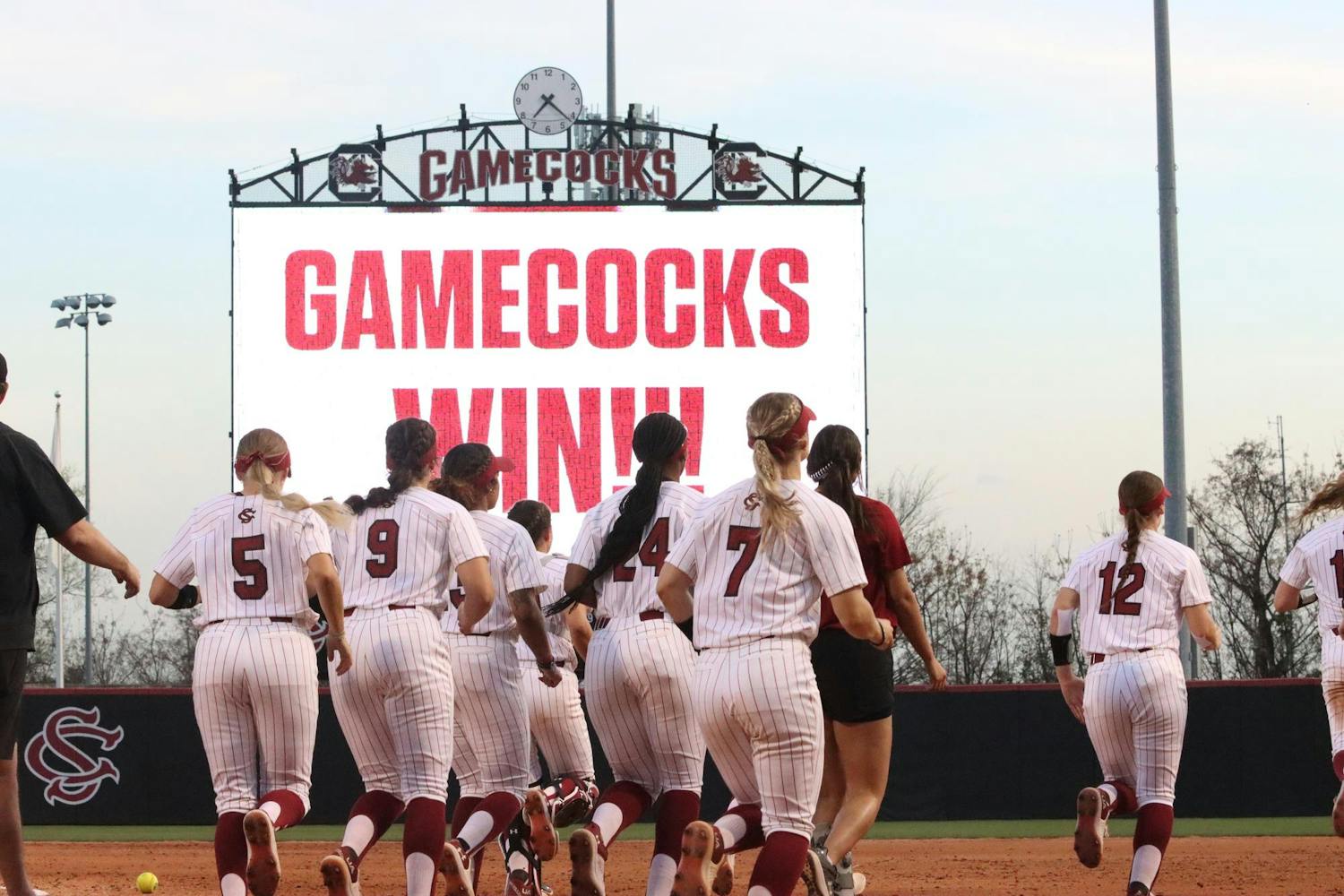 Members of the Gamecock softball team run to the outfield after their win against Minnesota on March 16, 2024. The Gamecocks shut out the Gophers 4-0.