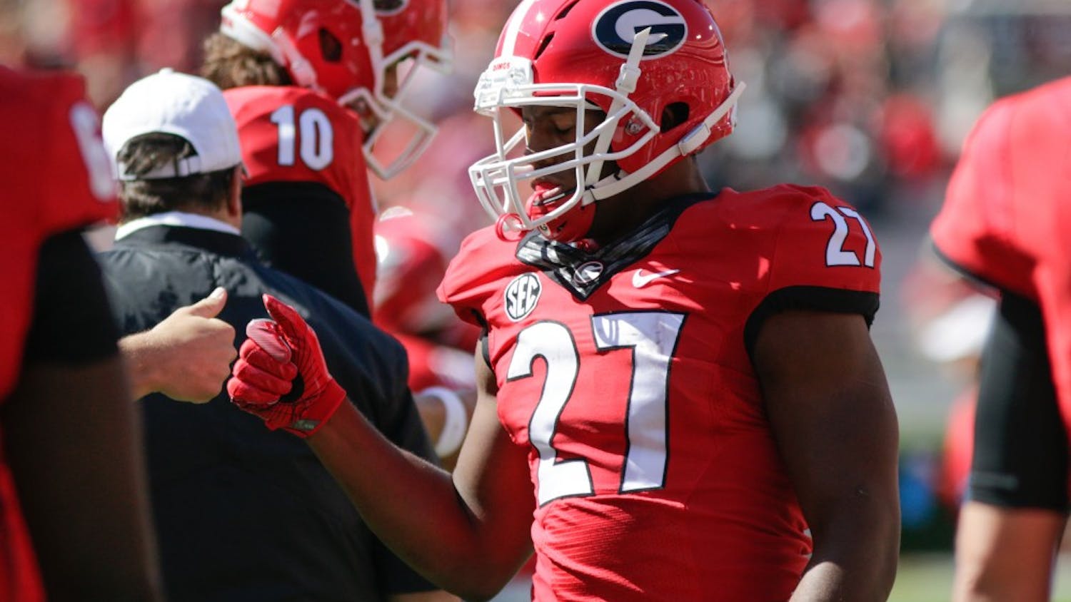 Georgia tailback Nick Chubb (27) fist bumps a teamate during pre-game warmups before the start of Georgia's regular season game versus the University of Tennessee at Sanford Stadium on Oct. 1, 2016 in Athens, Ga. (Photo/Thomas Mills)