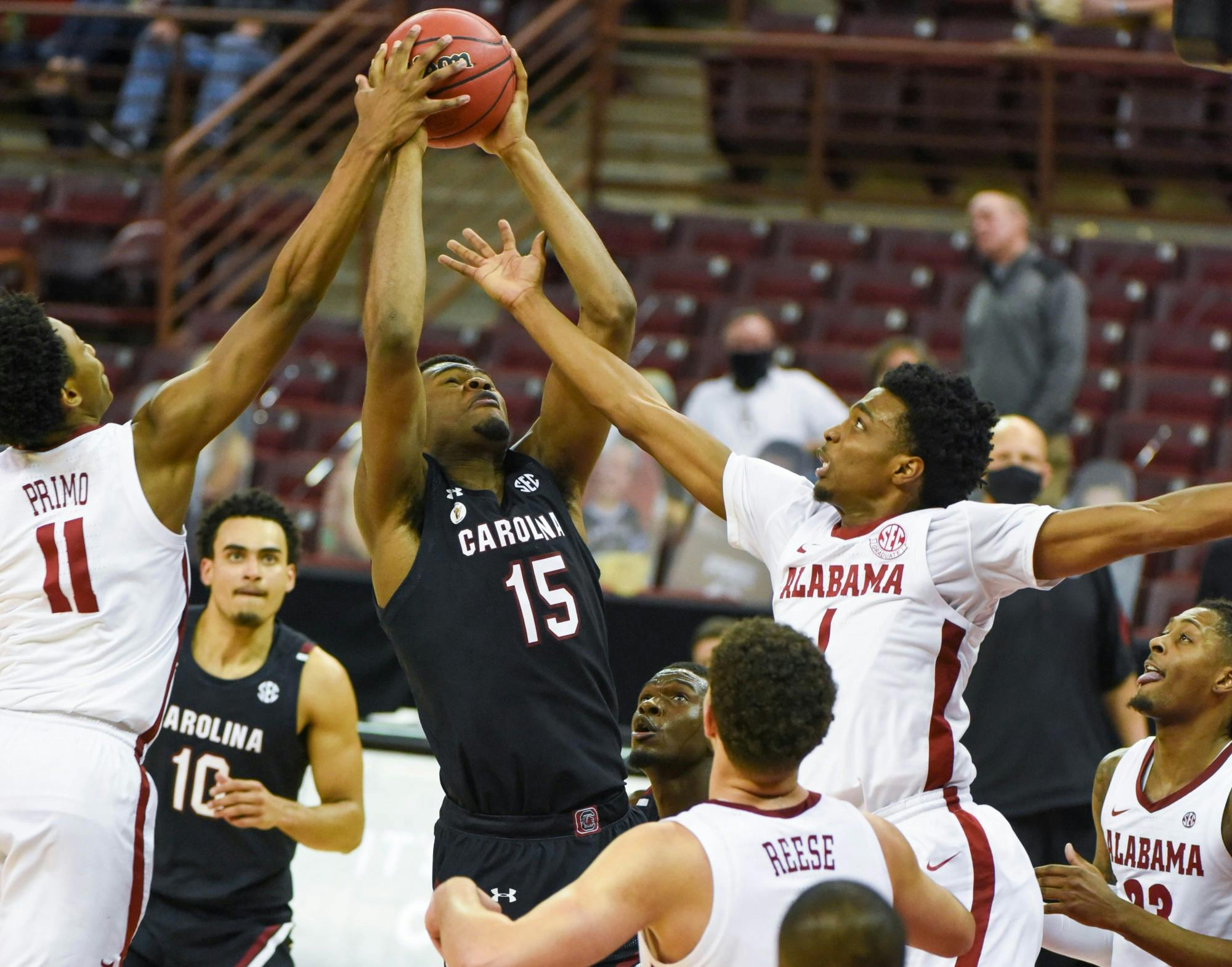 Sophomore forward/center Wildens Leveque holds the ball while Alabama players attempt to steal. South Carolina lost 81-78.