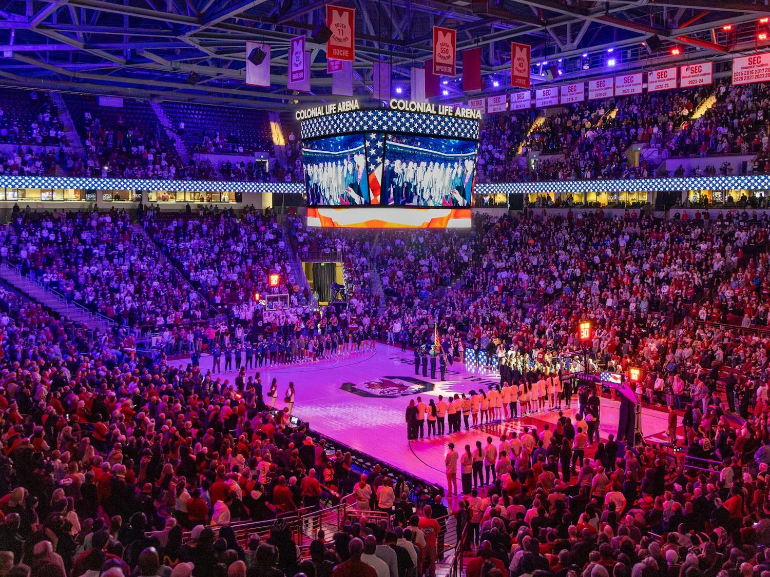 Fans in Colonial Life Arena stand during the singing of the National Anthem prior to No. 6 South Carolina's final regular season matchup against No. 15 Kentucky on March 2, 2025. The Gamecocks played in front of a crowd of 18,000.