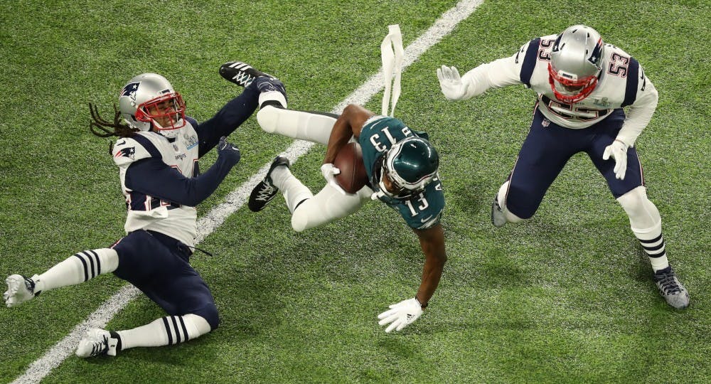 Philadelphia Eagles wide receiver Nelson Agholor (13) falls forward during the Eagles' first drive as Stephon Gilmore, left, and Kyle Van Noy defend in Super Bowl LII on Sunday, Feb. 4, 2018 in Minneapolis, Minn. (Elizabeth Flores/Minneapolis Star Tribune/TNS) 